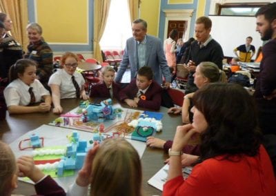 The winners present their design to the judges.